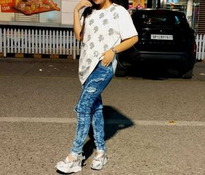 Ripped Blue Jeans With White Baggy Tshirt