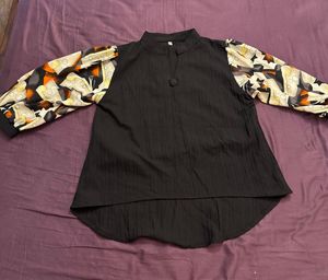 Unique Black Blouse with Patterned Sleeves