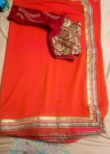 Orange Saree with Embroidered Blouse