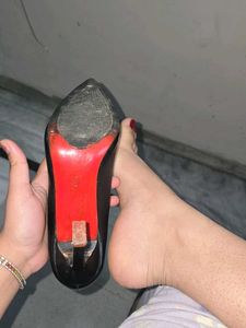 used red bottom black pointed heels
