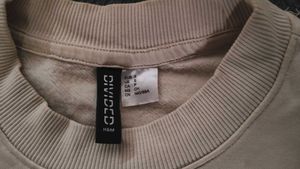 Compassionate Beige Sweatshirt