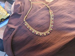 Elegant Gold-Tone Necklace with Red Accents