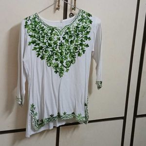 white chikankari kurti with green embroidery