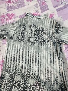 A Mesh Top Shirt Which Is In Greyish Colour