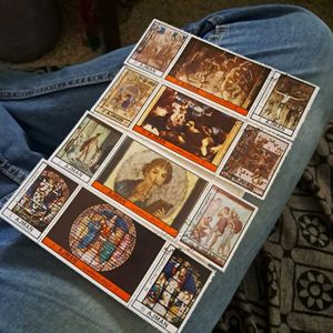 12 Vintage AJMAN painting stamps.