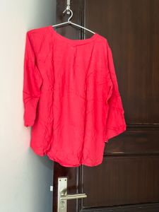 Red Top With Black Button In Front