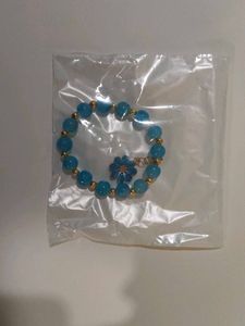 Blue Beaded Bracelet with Daisy Charm