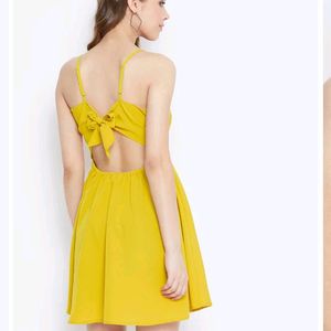 Today&#39;s Offer ₹150 Berrylush Women Solid Yellow Front Twist Knot Fit &amp; Flare Mini Dress For Women (Mustard Colour)