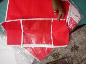 Red and printed saree bag