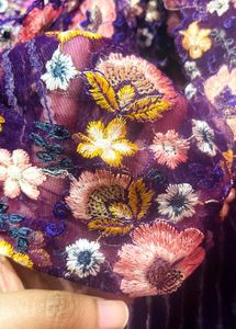 Celebrity Purple Netted Saree With Designer Blouse