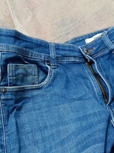Distressed Denim Jeans With Scratches