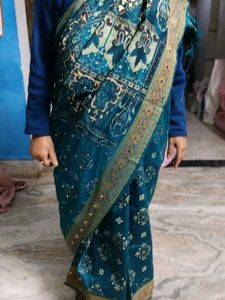 Elegant Teal Saree with Gold Accents