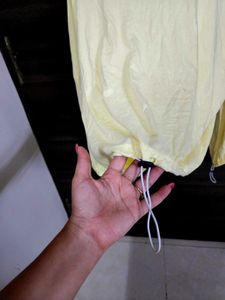 Yellow Long Sleeve Top with elastic at the bottom.