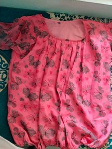 This Is A Top With Floral Print.