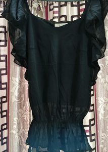 The perfect black top, elevated.