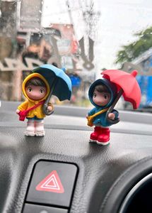 Cute cartoon little girl holding an umbrella
