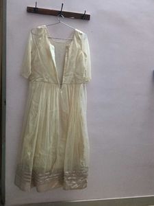 A Cream Coloured ,Net Material Gown