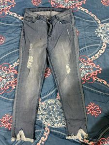 Distressed Fringe Hem Jeans