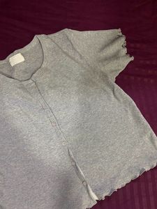grey button top