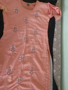 Its a orange Colour Kurta With Hand Work Design