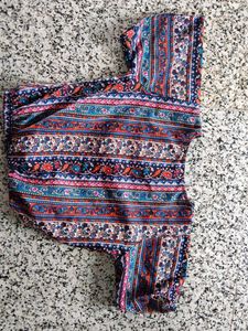 Patterned top traditional goes with black skirt
