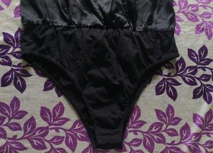 blacksatinbodysuit with a collared, wrap-style Top