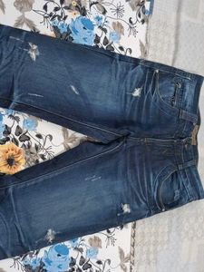 Distressed Blue Denim Jeans