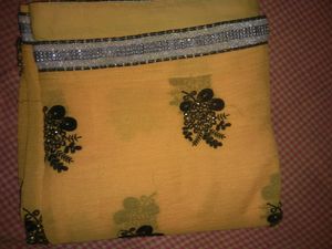 Elegant Yellow Saree With Beautiful Black And Silver Border