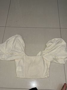 White puff sleeve tie-front top