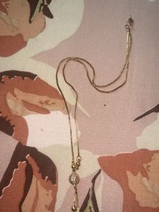 One Gold Pleated Chain And Earing