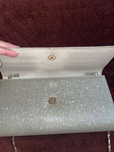 Sparkling Silver Clutch cum sling with chain👛