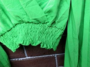 Bright green crop top.