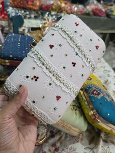 Laces Stones Hand Clutch With Sling