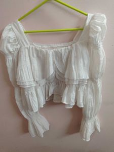 white bell bottom sleeves top.
