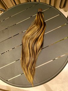 Pony Tail Hair Extensions In Blonde Highlights