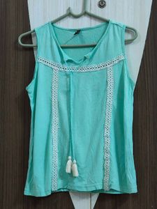 cyan sleeveless top 🩵