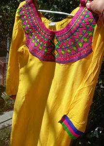Yellow Kurti With Multicolor Embroidered Yoke