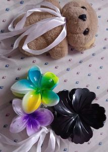 combo of 3 clutches and a teddy bear