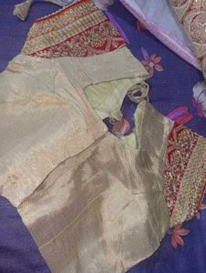 Red Heavy Saree With Golden Blouse.