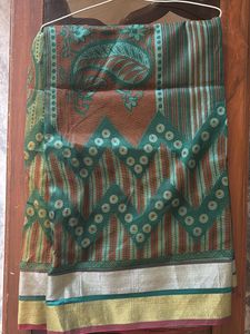 Green Net Saree With Silver And Red Border