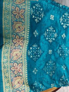 Elegant Teal Saree with Gold Accents