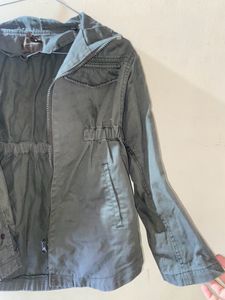 A Green Jacket For Both Girls And Boys