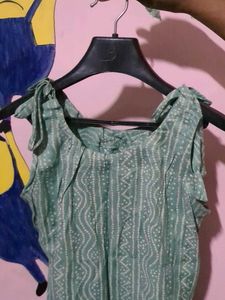 It is Knee Length Sleeveless Kurti With Straps