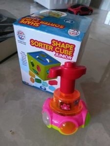 Shape Sorter And Spinning Toy