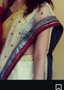 Yellow Net Saree With Sleeveless green Blouse