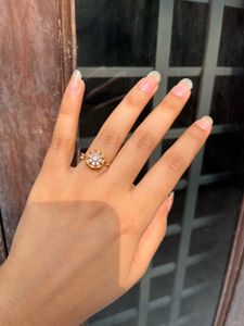 Elegant Gold Rotating Flower Ring