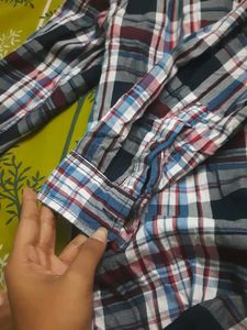 Stylish boys&#39; plaid shirt with an attached hoodie.