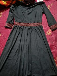 Elegant Black Dress with Red Embroidery