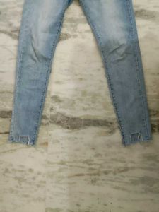 Light Wash Distressed Hem Jeans