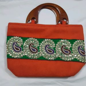 handcrafted purse with kundan work